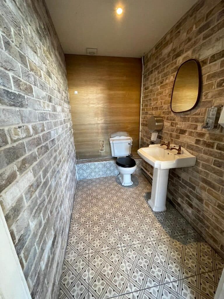 brick cladding in commercial bathroom